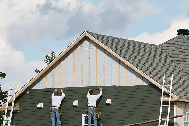 Professional Siding Replacement technician working in Roosevelt, NY